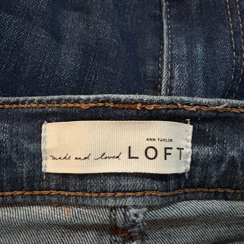 LOFT Skinny Mid Rise Jeans with split raw hem.